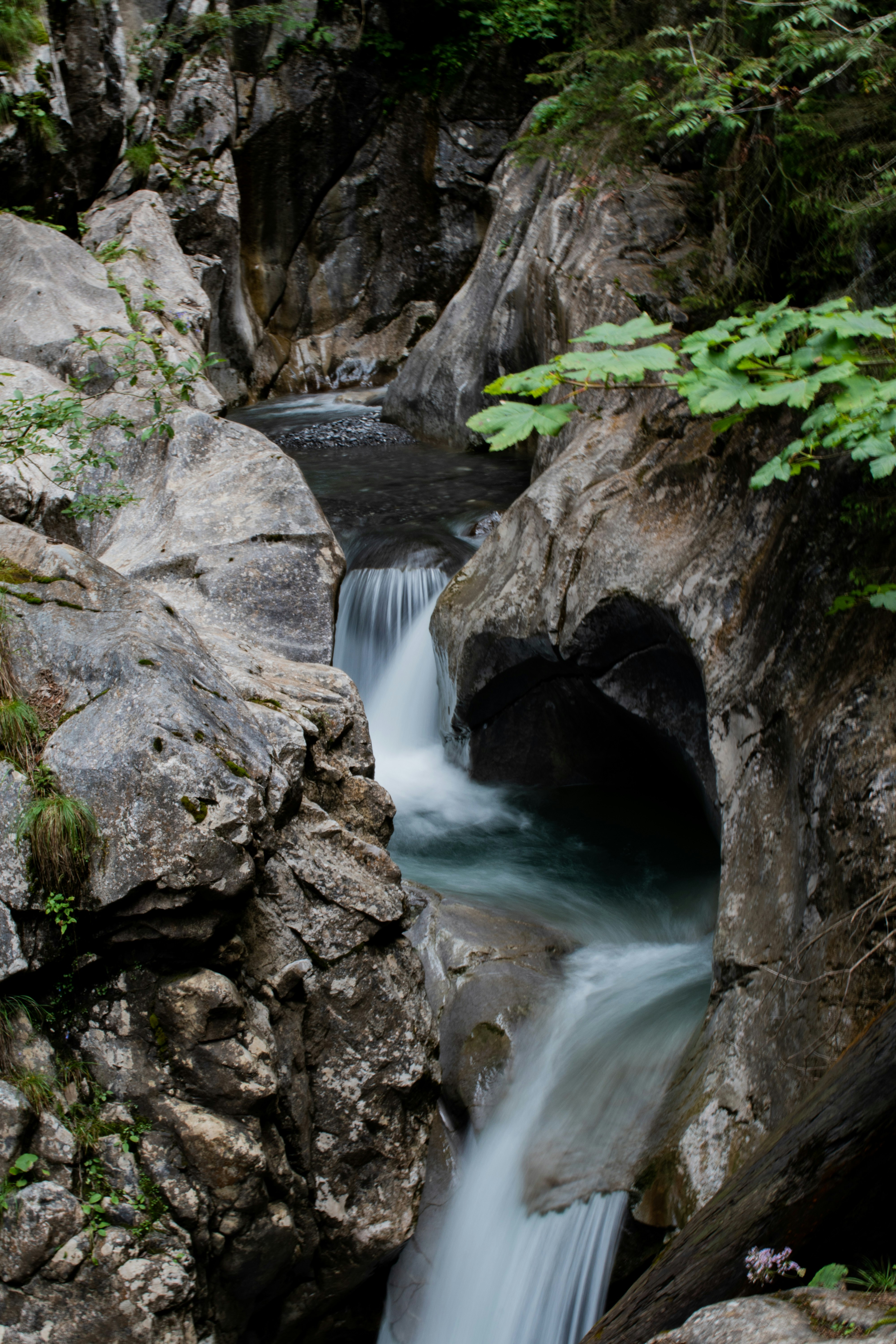 water falls between rocks and rocks